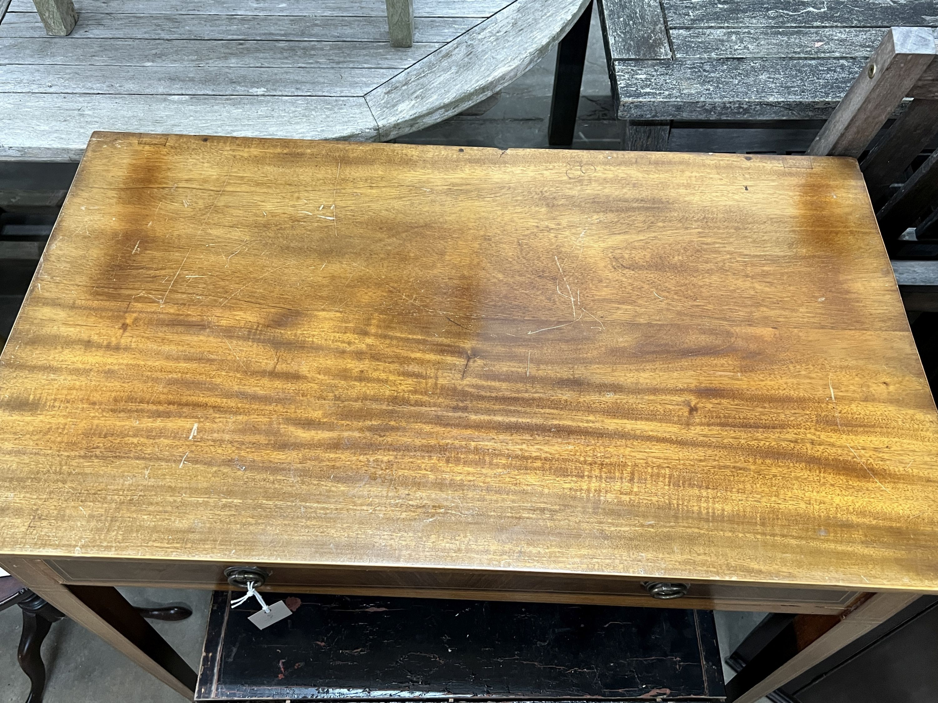An Edwardian inlaid mahogany writing table, width 87cm, depth 50cm, height 77cm